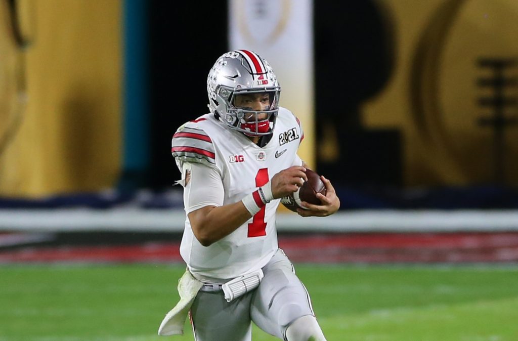 Ohio State quarterback Justin Fields runs with the ball against Alabama on Jan. 11, 2021, at Hard Rock Stadium in Miami Gardens, Florida. | David Rosenblum/Icon Sportswire via Getty Images