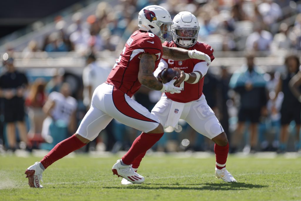 Cardinals running back James Conner taking handoff from Kyler Murray