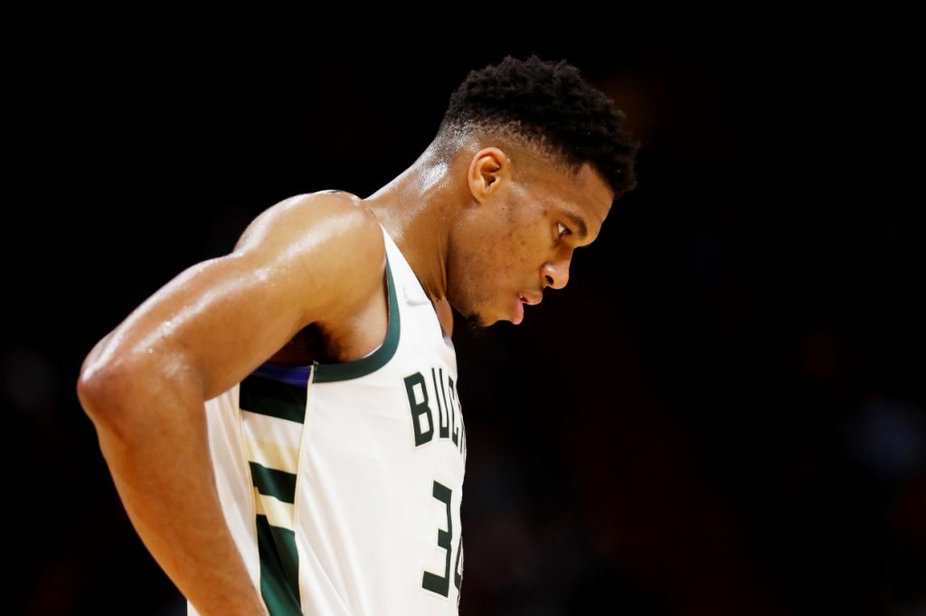 Giannis Antetokounmpo of the Milwaukee Bucks reacts to a play during an NBA game.