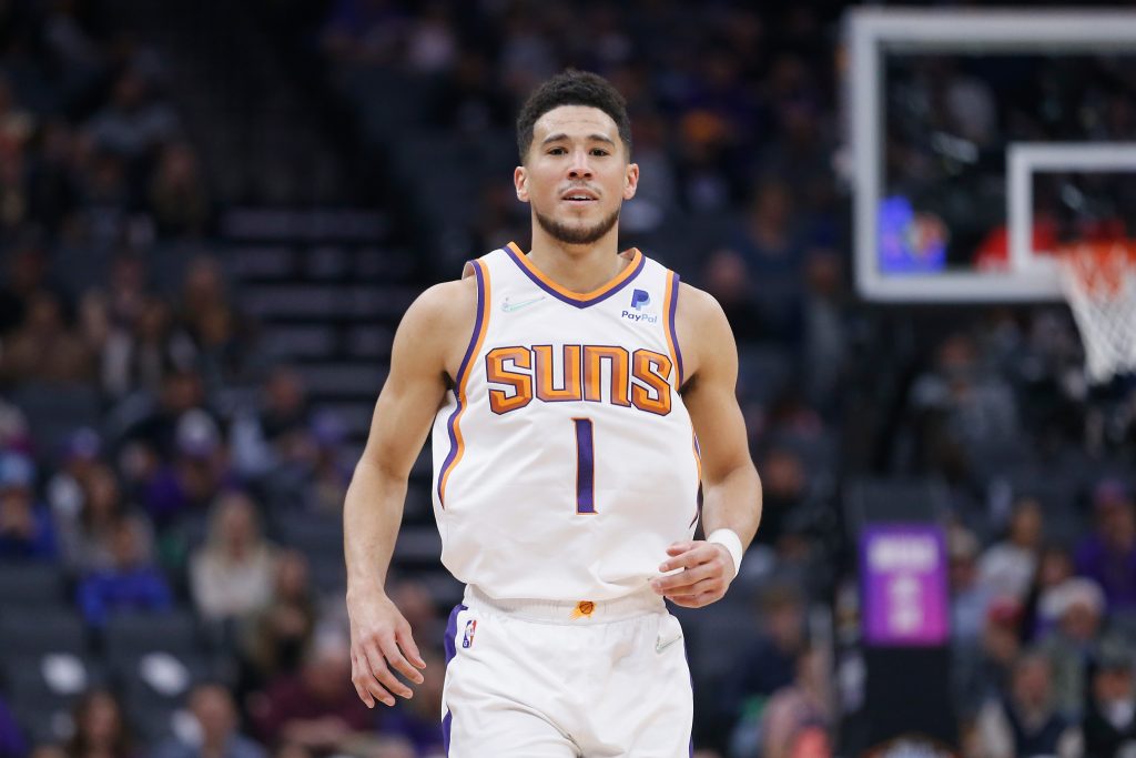 Phoenix Suns guard Devin Booker reacts during an NBA game against the Sacramento Kings in March 2022