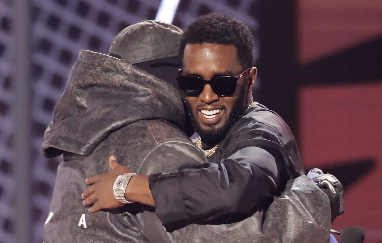 Diddy accepts the Lifetime Achievement Award from Kanye West at the 2022 BET Awards