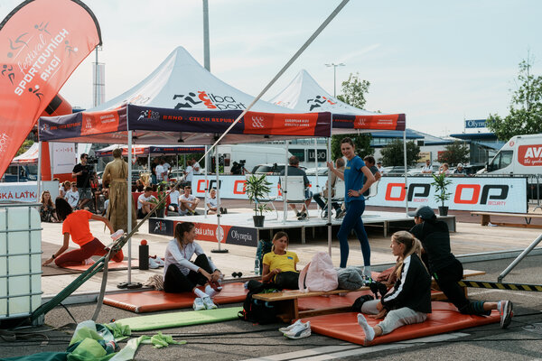 Ukranian high-jump athletes warming up before the competition in Brno. The meet was held in a shopping center parking lot.