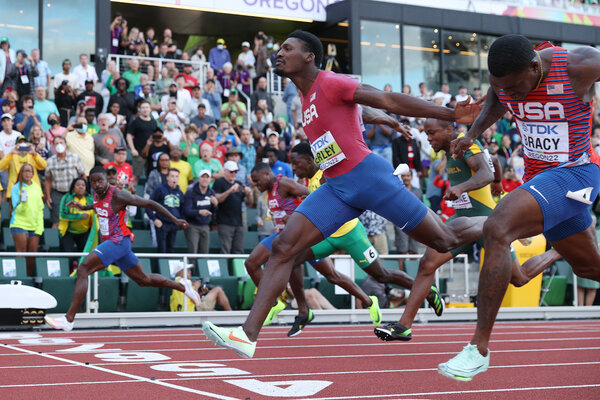 Fred Kerley, Marvin Bracy and Trayvon Bromell lean past the 100-meter finish line for the podium sweep.
