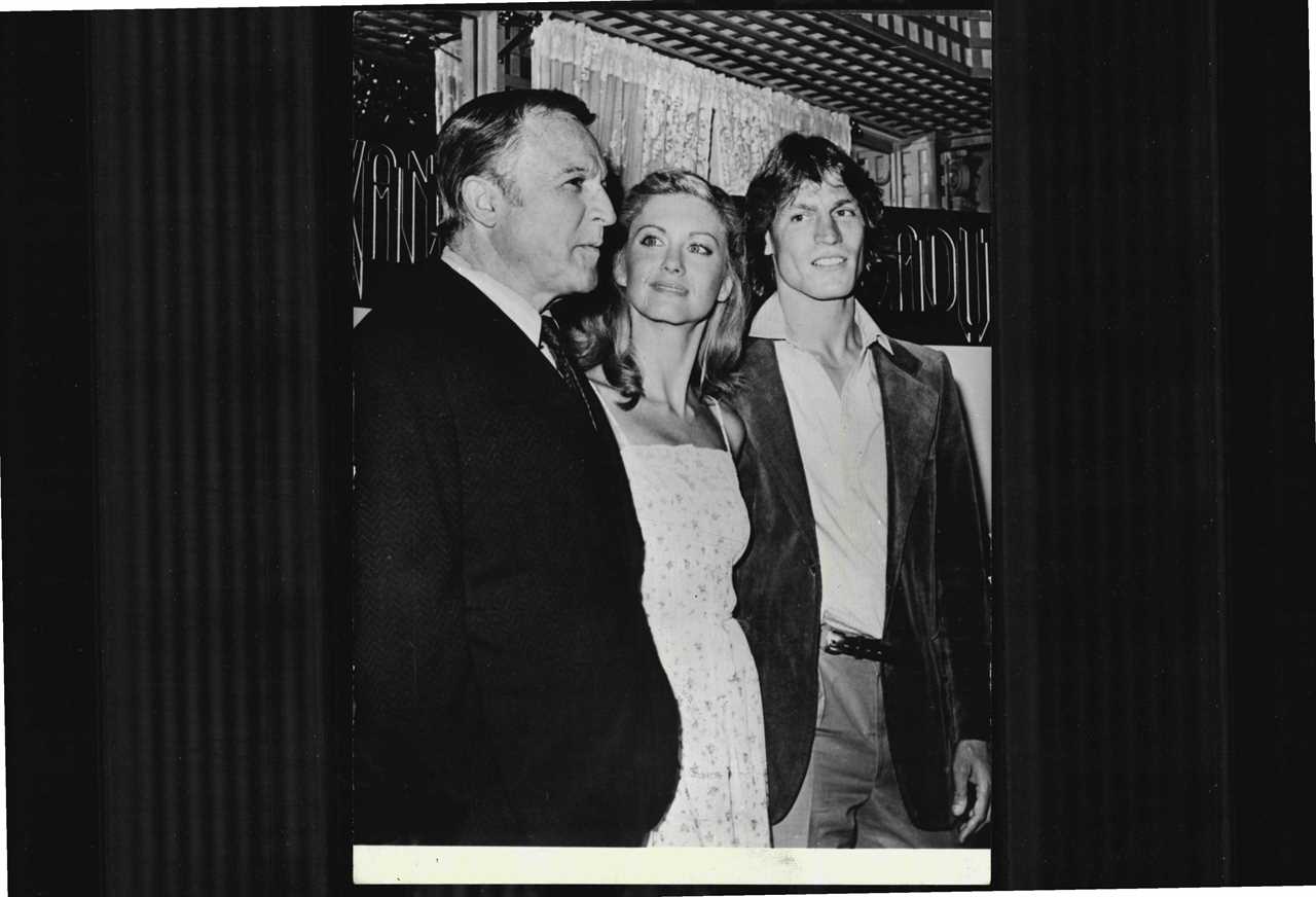 Gene Kelly, Olivia Newton-John and Michael Beck at a party to launch the start of their new film together titled, "Xanadu" in 1980