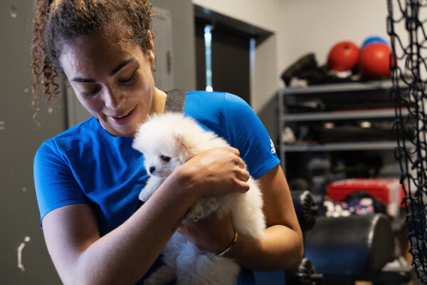 Nurse with her new puppy, Romeo, at Grit Athletics in Toronto.