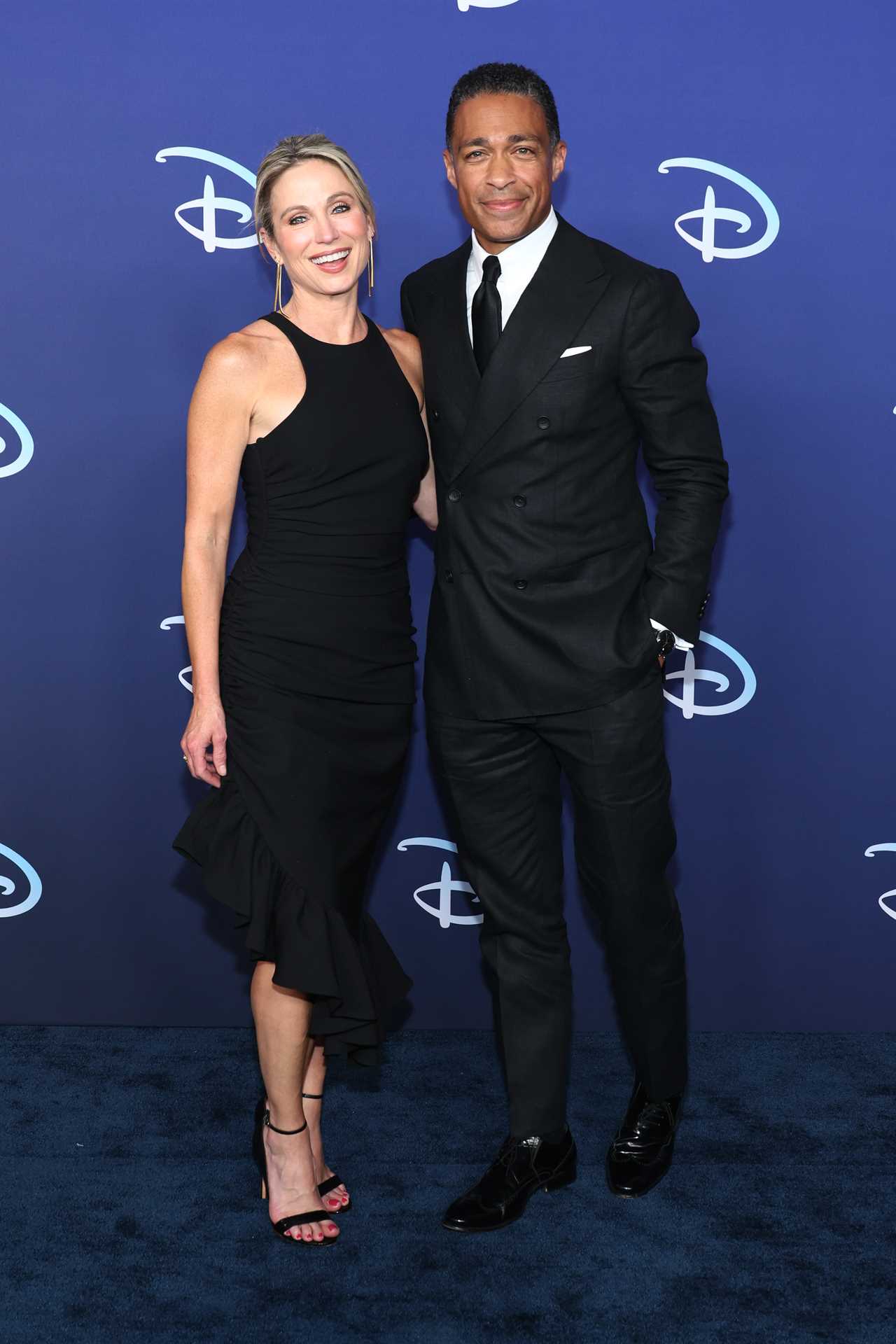 Amy Robach and TJ Holmes attend the 2022 ABC Disney Upfront at Basketball City - Pier 36 - South Street on May 17, 2022 in New York City.