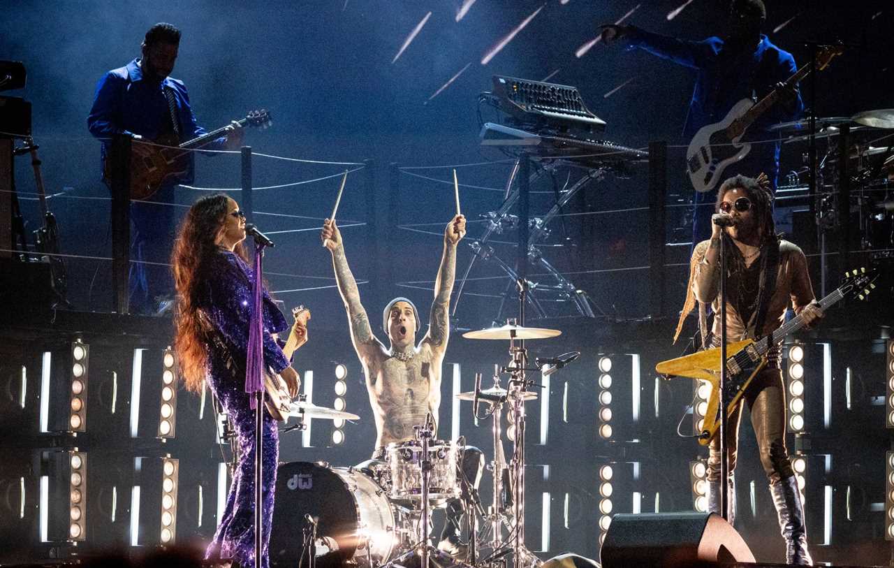 H.E.R., Travis Barker, and Lenny Kravitz perform onstage during the 64th annual GRAMMY awards on April 03, 2022 in Las Vegas, Nevada. Credit: Emma McIntyre/Getty