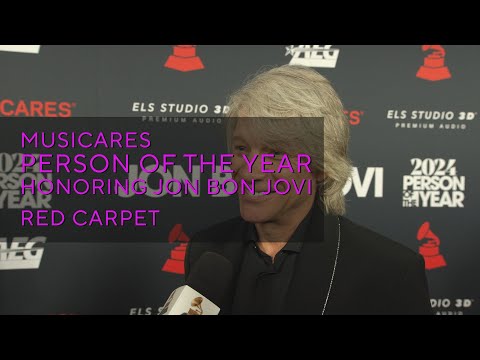 Watch Jon Bon Jovi, Jim Gaffigan & Jellyroll Walk The 2024 MusiCares Person Of The Year Red Carpet