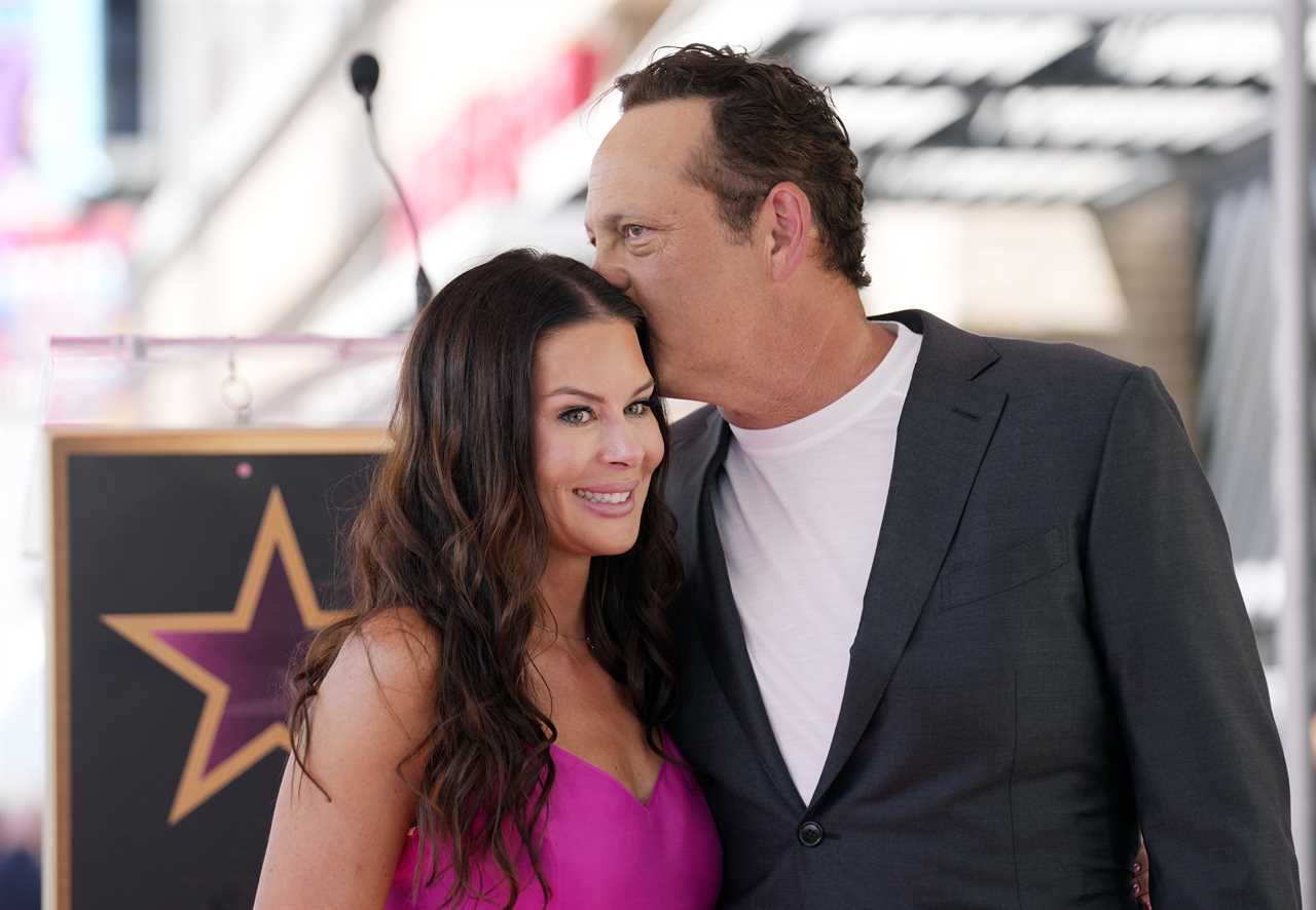 Actor Vince Vaughn, right, kisses his wife Kyla Weber during a ceremony to award him a star on the Hollywood Walk of Fame