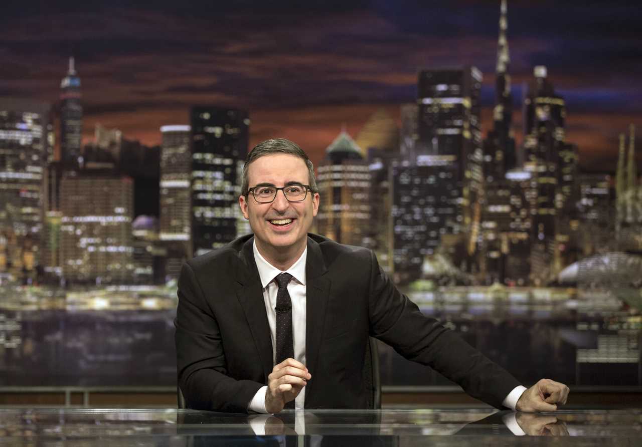 John Oliver fights back after being played off stage while eulogising his dog
