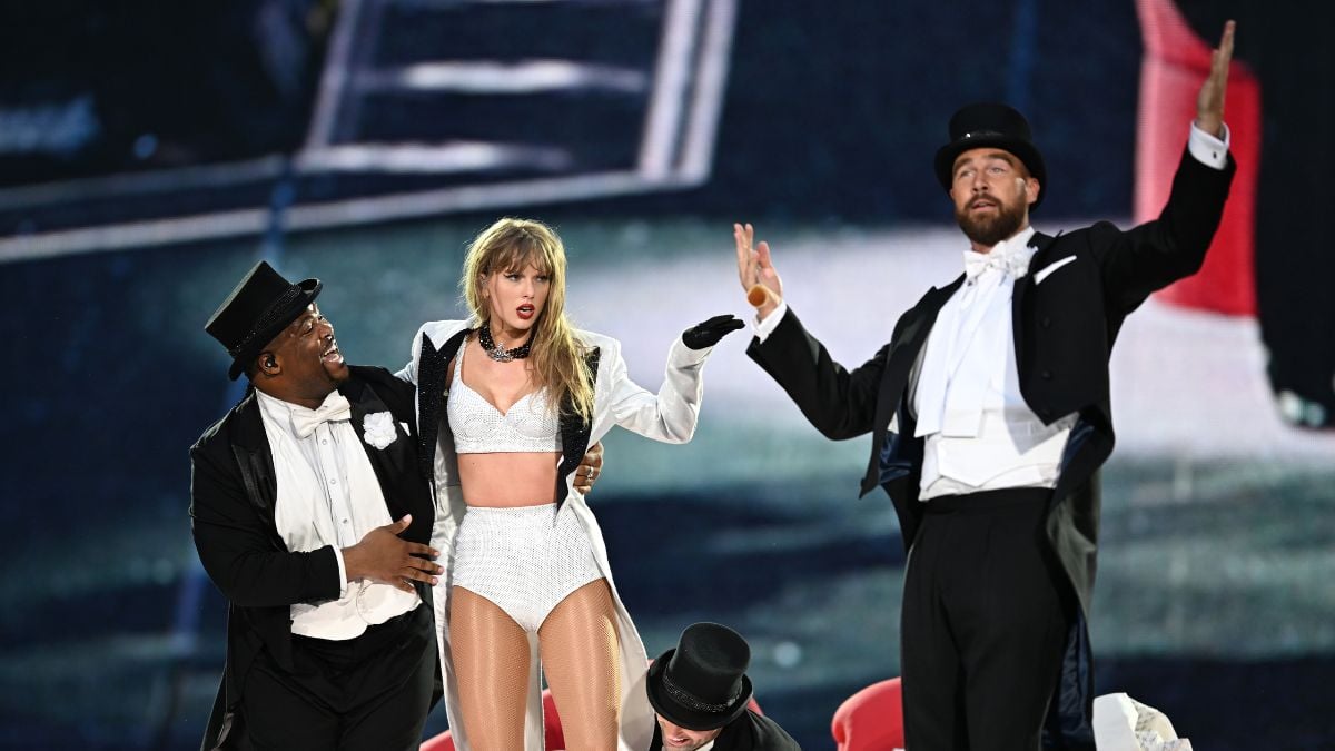 Taylor Swift is joined on stage by Travis Kelce (R), during "Taylor Swift | The Eras Tour" at Wembley Stadium on June 23, 2024 in London, England.