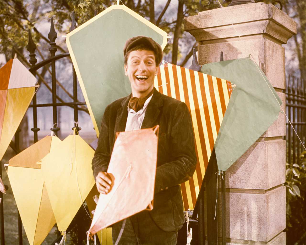 Dick Van Dyke, US actor, poses with a variety of kites in a publicity still for the film, 'Mary Poppins', USA, 1964. The film musical, directed by Robert Stevenson (19051986), starred Van Dyke as 'Bert'. 