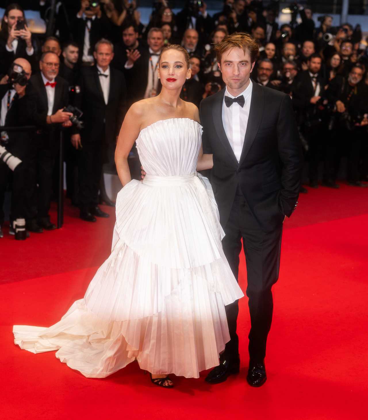 Jennifer Lawrence and Robert Pattinson attend the Die My Love red carpet at the 78th annual Cannes Film Festival at Palais des Festivals on May 17, 2025 in Cannes, France.
