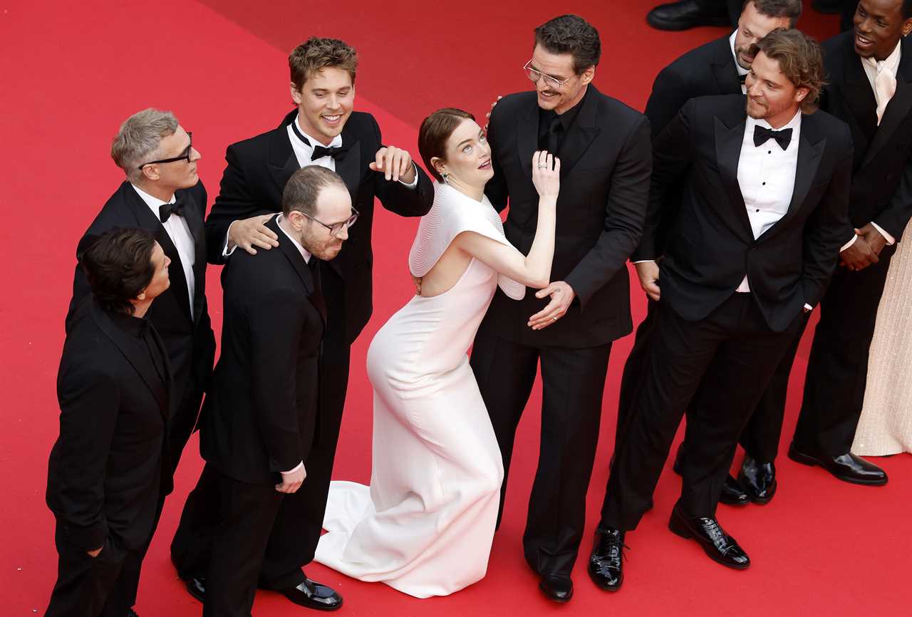 Emma Stone tries to avoid a bee next to Austin Butler, Pedro Pascal and director Ari Aster, Joaquin Phoenix, Clifton Collins Jr., Luke Grimes and Micheal Ward at the premiere of Eddington during the 78th annual Cannes Film Festival, in Cannes, France, 16 May 2025