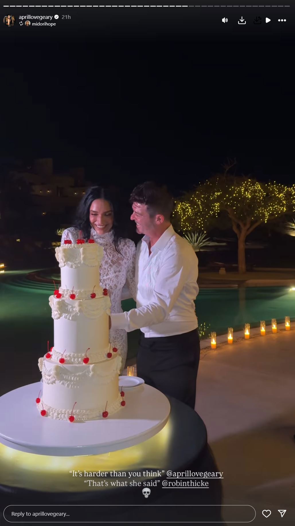April Love Geary and Robin Thicke cut their wedding cake