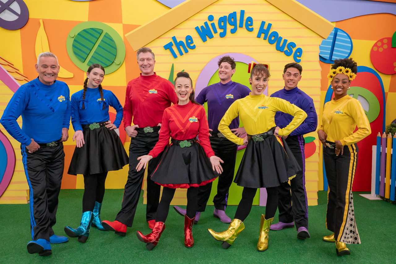 The Wiggles' modern lineup, including Anthony Field (left) and the first woman of colour in the main cast Tsehay Hawkins (right).