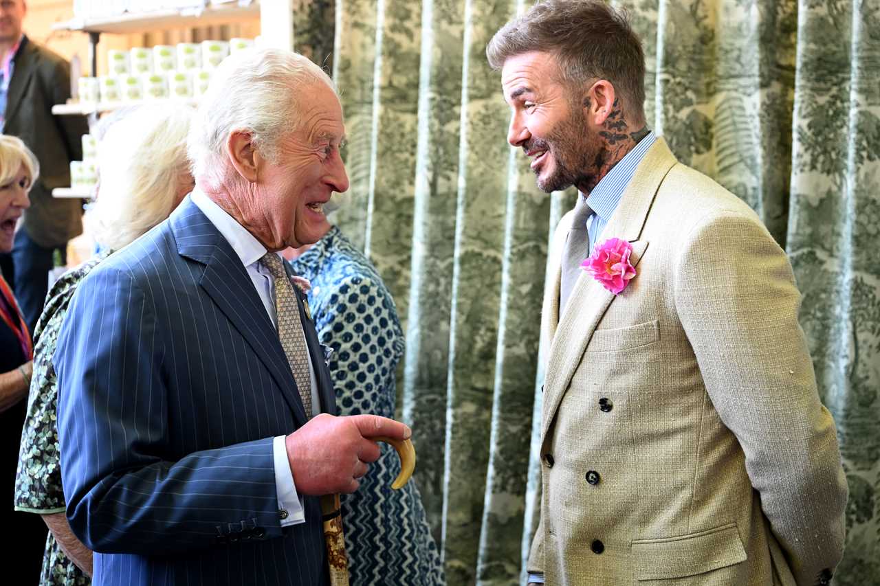 David Beckham, wearing the King's Rose, with King Charles and Queen Camilla during a visit to the Chelsea Flower Show on Monday May 19, 2025.