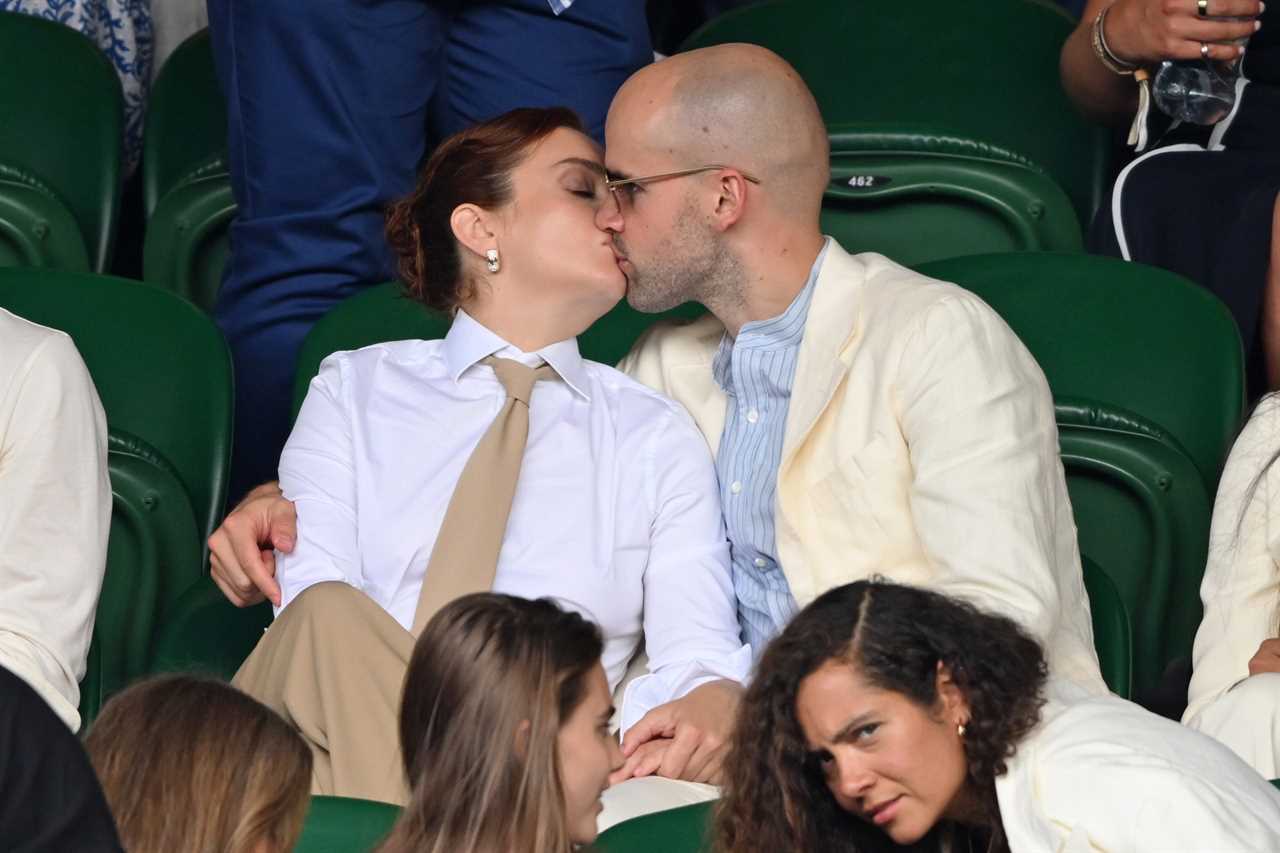 Olivia Cooke kisses Ralph Davis in the stands during day 10 of the Wimbledon Tennis Championships at the All England Tennis and Croquet Club at on July 9, 2025 in London, England.