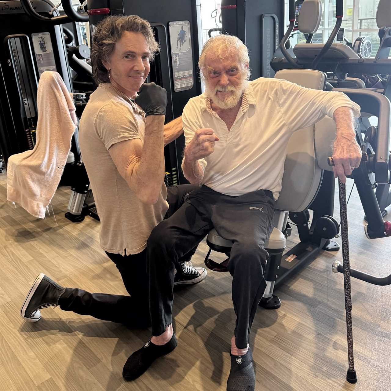 Rick Springsteen poses with Dick Van Dyke in the gym