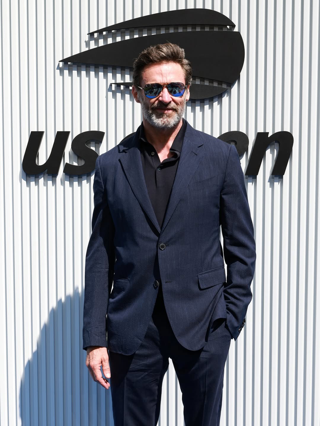 Jackman, 56, was spotted at the US Open today with Anna Wintour, posting his red carpet outfit to his Instagram.