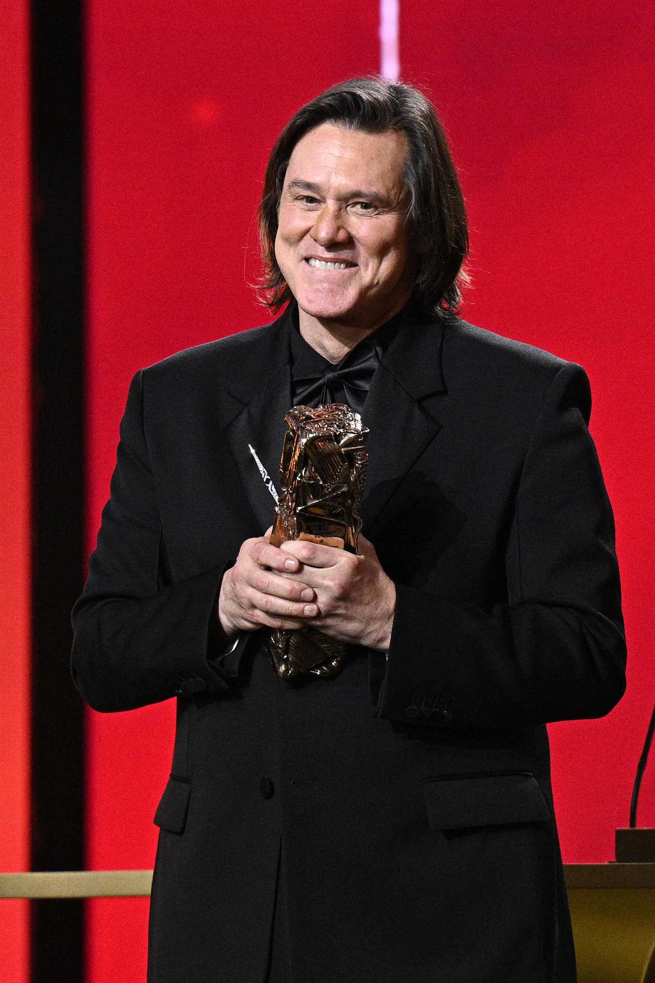 PARIS, FRANCE - FEBRUARY 26: Jim Carrey accepts the Honorary Cesar Award during the 51st Cesar Film Awards at L'Olympia on February 26, 2026 in Paris, France. (Photo by Kristy Sparow/Getty Images)