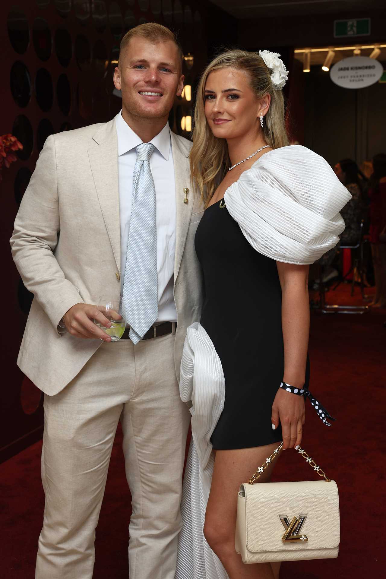 Jackson Warne and Kiah Broadsmith pose for a photo during 2025 Melbourne Cup Day at Flemington Racecourse on November 4, 2025 in Melbourne, Australia