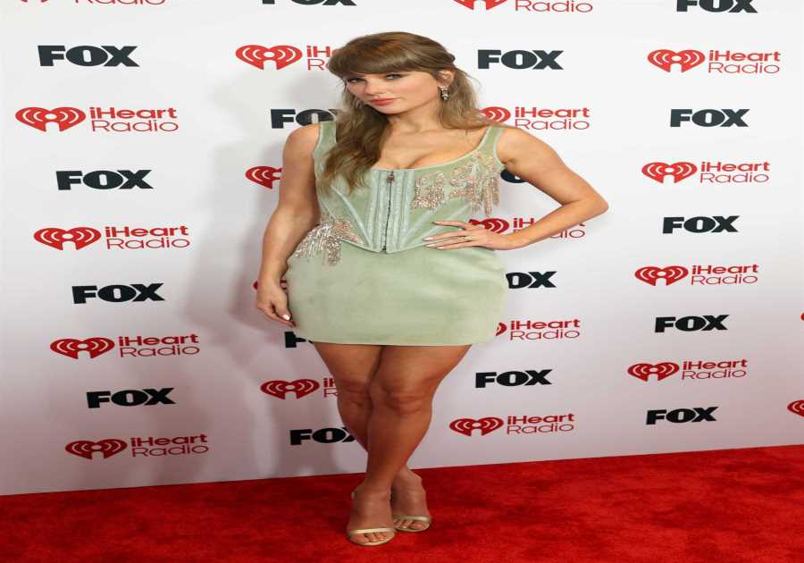 Taylor Swift shines in corset-style dress as she makes rare appearance at the iHeart Music Awards 