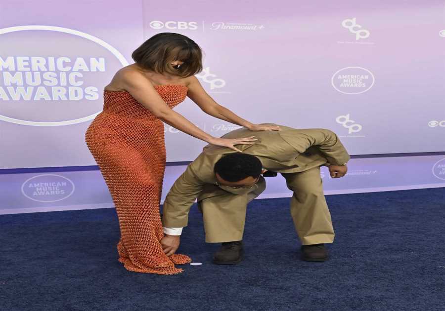 John Legend Saves Chrissy Teigen From Wardrobe Malfunction at 2026 AMAs