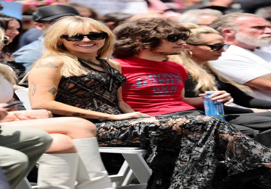 Miley Cyrus Rocks Naked Dress, Reunites With Family at Walk of Fame Event